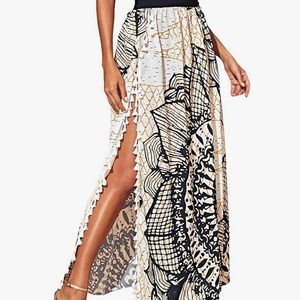 High waisted maxi skirt with floral pattern and black band. Size medium